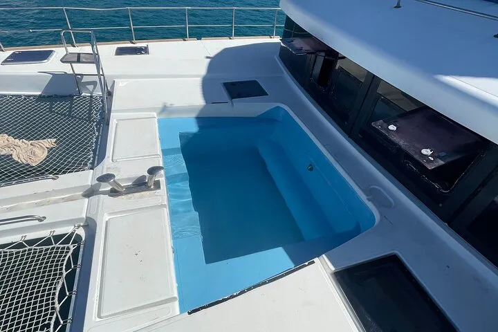 Group enjoying drinks on catamaran